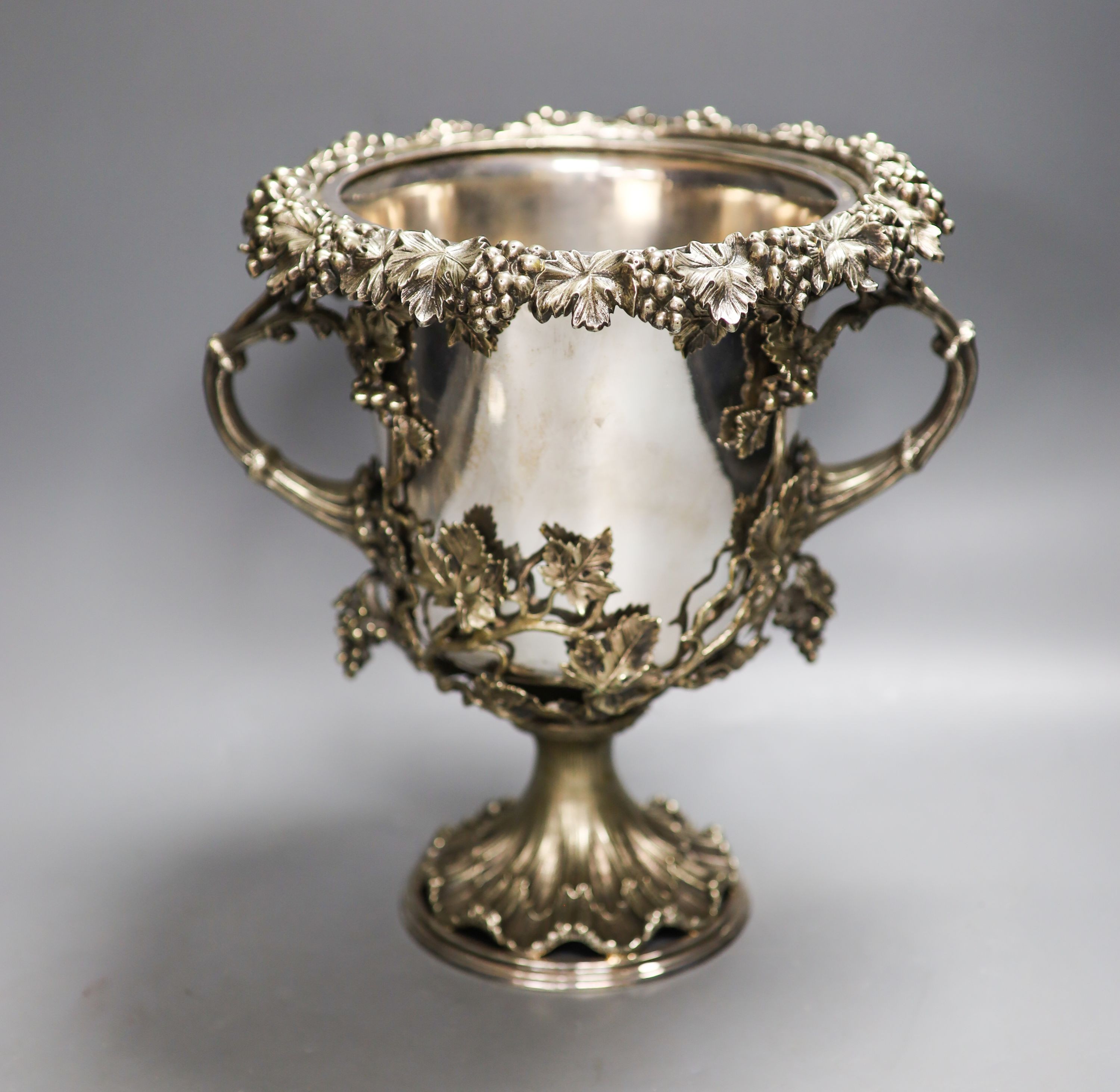 A Victorian campana shaped plated wine cooler, cast with fruiting vines 28cm